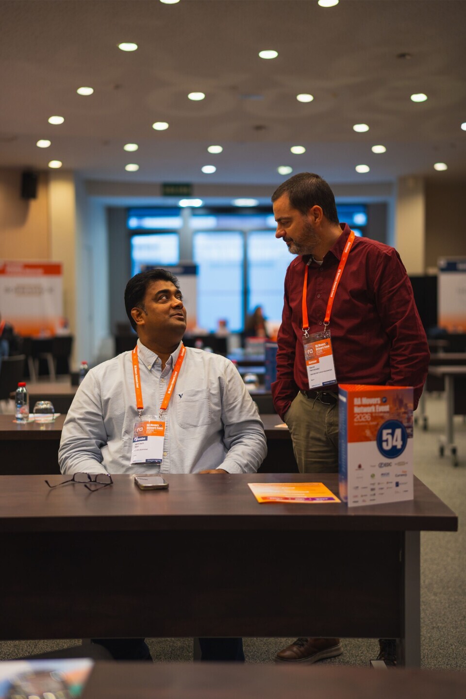 Two attendees talking during a networking break